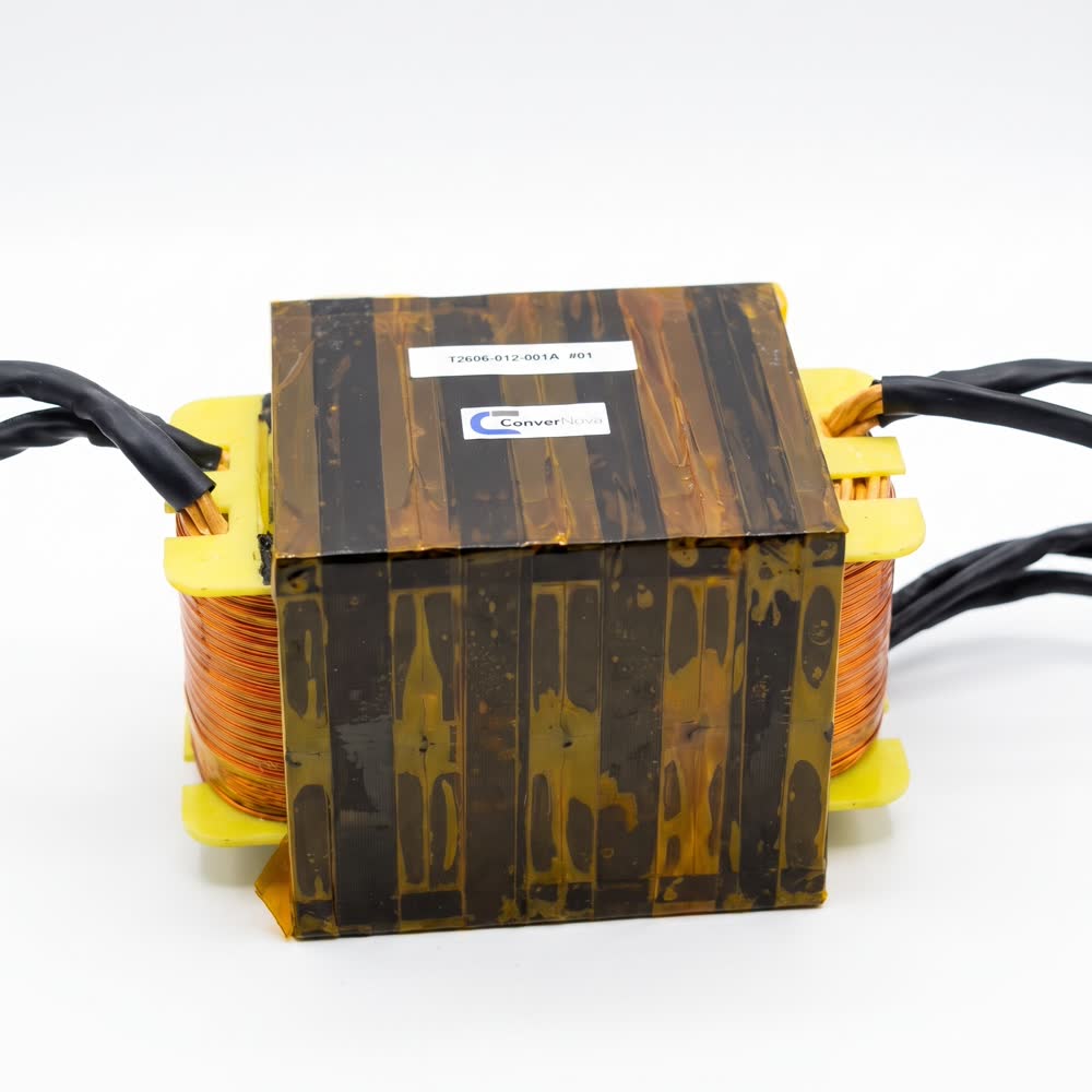 A transformer taped in amber polyimide, marked and lead terminated